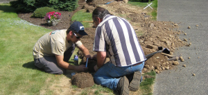 two techs repairing a cracked delivery line in Mesquite